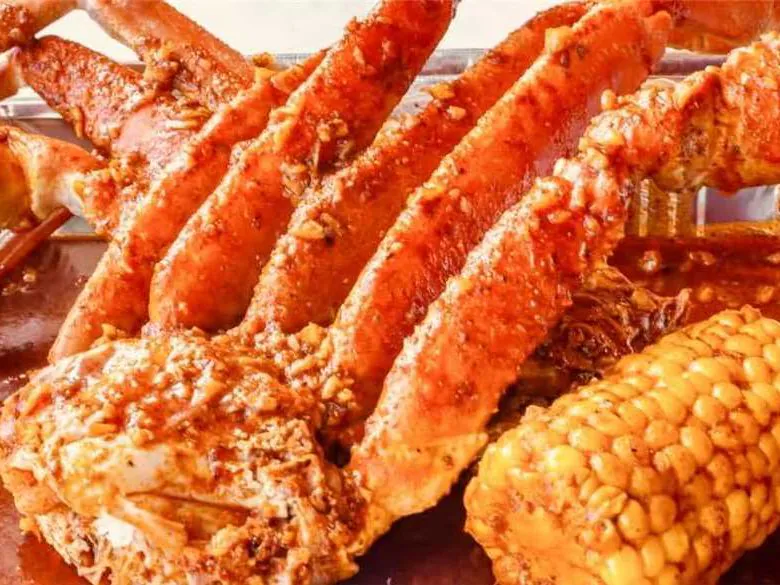 Garlic butter snow crab legs with corn at Dummy Crabby III, a Seafood Restaurant in Tampa
