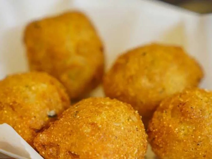 Crispy fried cornmeal balls at Dummy Crabby III, a Seafood Restaurant in Tampa